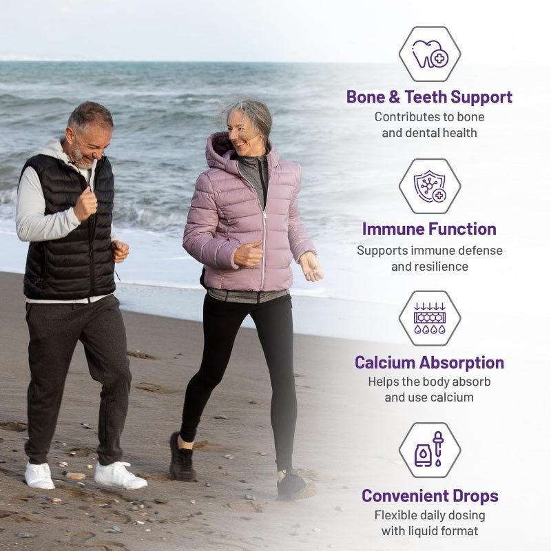 An elderly couple walking on a beach with informational text overlays on the right detailing health benefits of drops: Bone & Teeth Support, Immune Function, Calcium Absorption, and Convenient Drops.